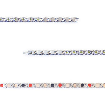 Close-up view of stainless steel links with green crystal accents and fine detailing.